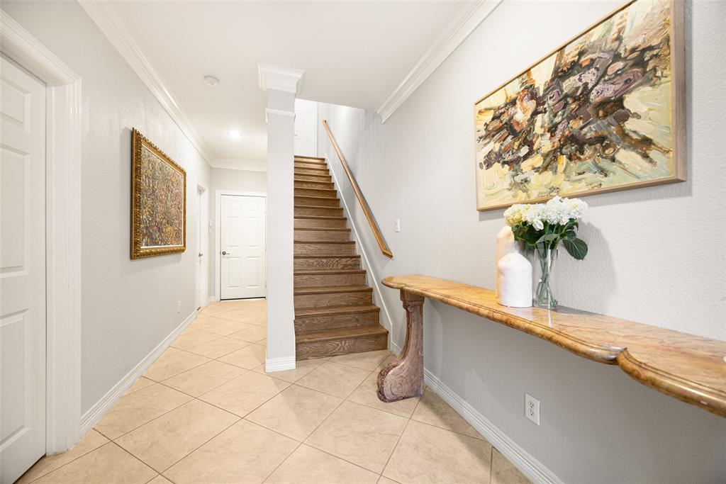 3610 Gillespie Street, Unit 6 Dallas, TX 75219 - Photo 2 of 27 a view of entryway with paintings on the wall
