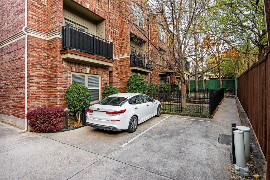 3610 Gillespie Street, Unit 6 Dallas, TX 75219 - Photo 26 of 27 a car parked in front of a brick building