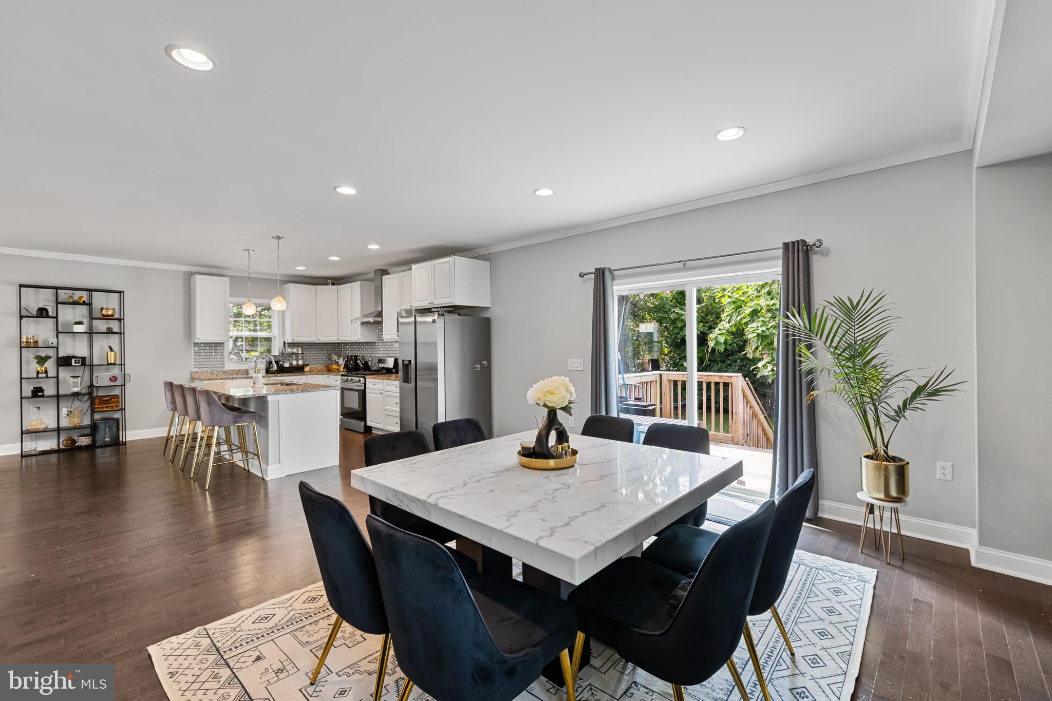 3327 5th Street Southeast Washington, DC 20032 - Photo 15 of 42 a view of a dining room with furniture and wooden floor
