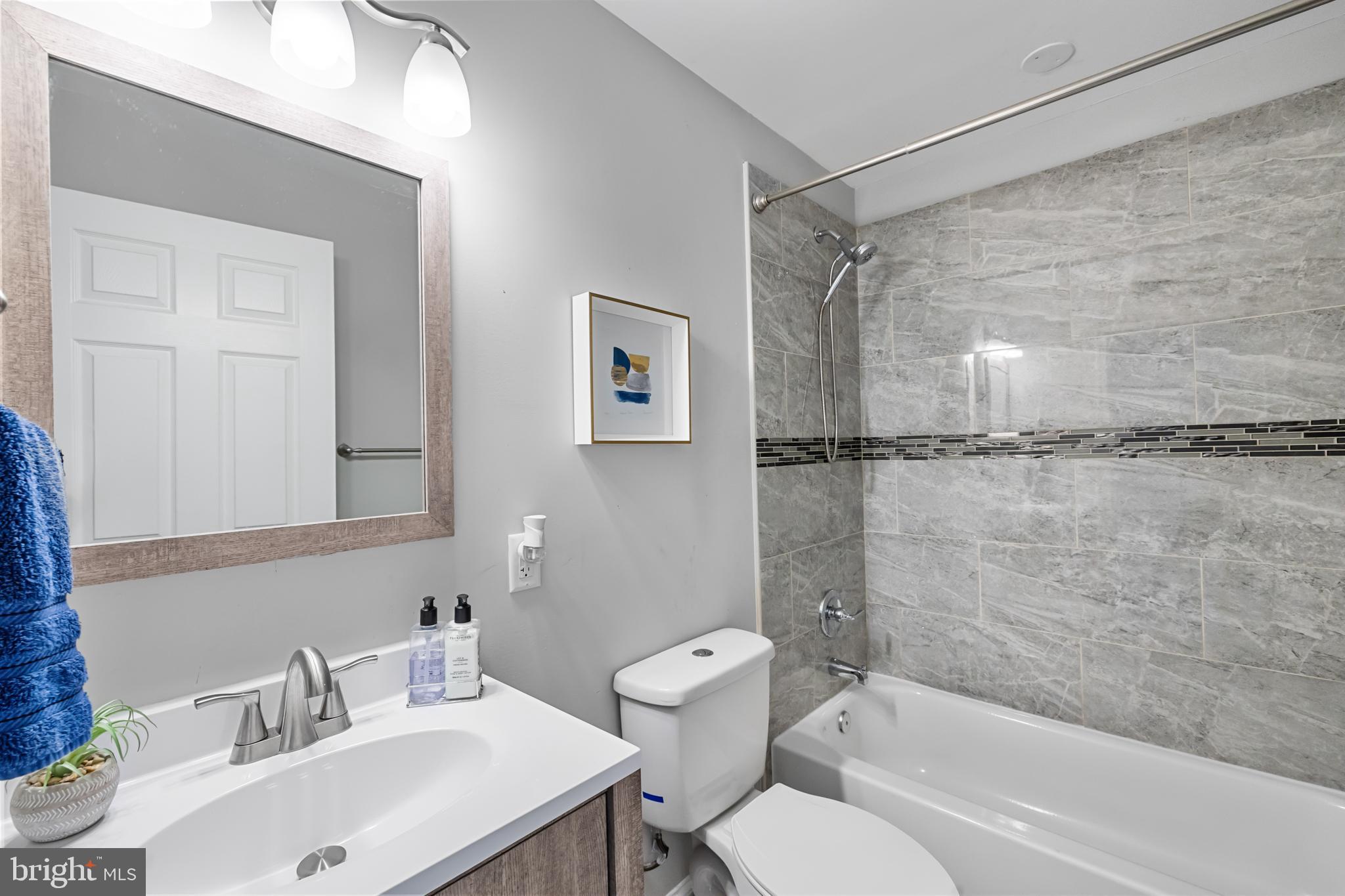 3327 5th Street Southeast Washington, DC 20032 - Photo 22 of 42 a bathroom with a sink mirror toilet and bathtub