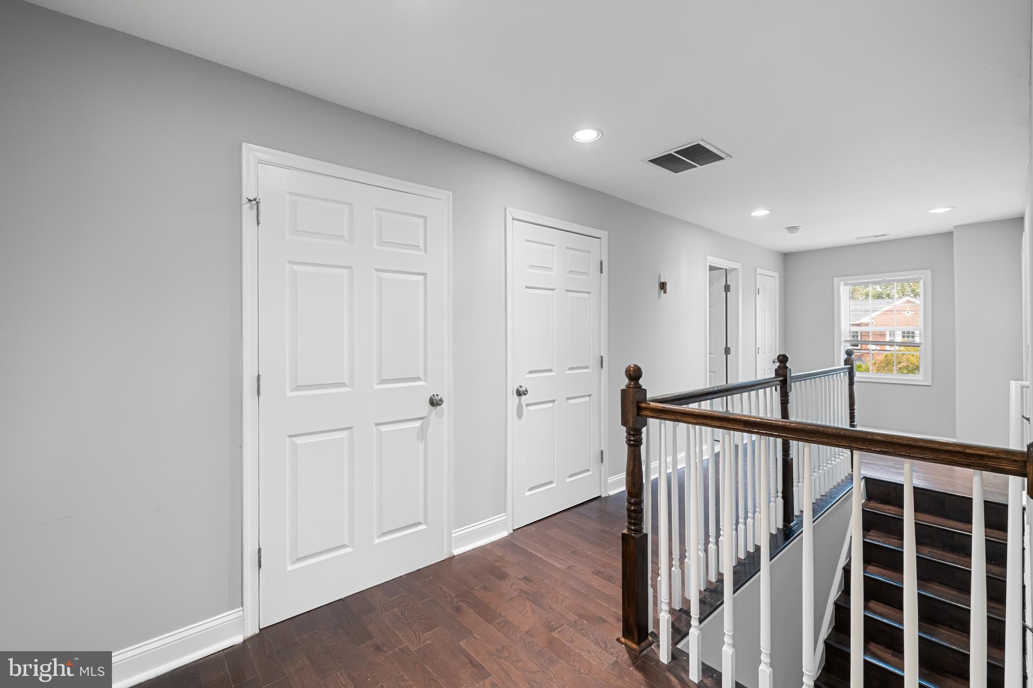 3327 5th Street Southeast Washington, DC 20032 - Photo 23 of 42 a view of a hallway with wooden floor and windows