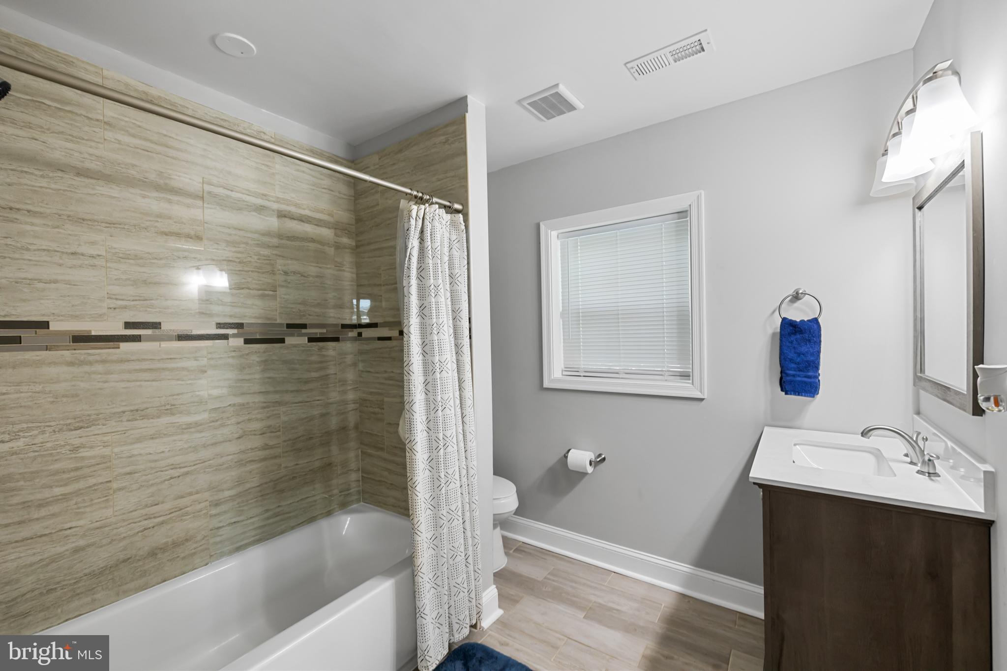 3327 5th Street Southeast Washington, DC 20032 - Photo 30 of 42 a bathroom with a bathtub and a sink