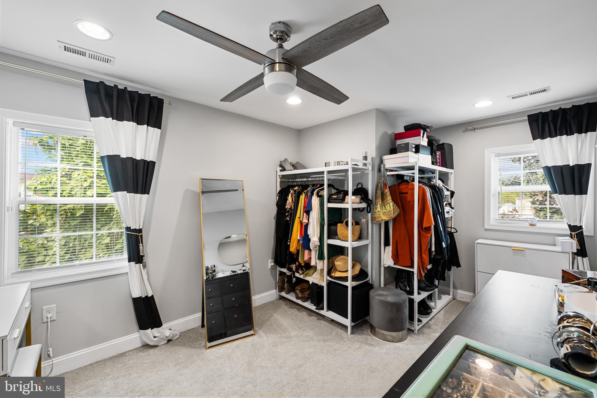 3327 5th Street Southeast Washington, DC 20032 - Photo 32 of 42 a view of walk in closet with clothes and shoes