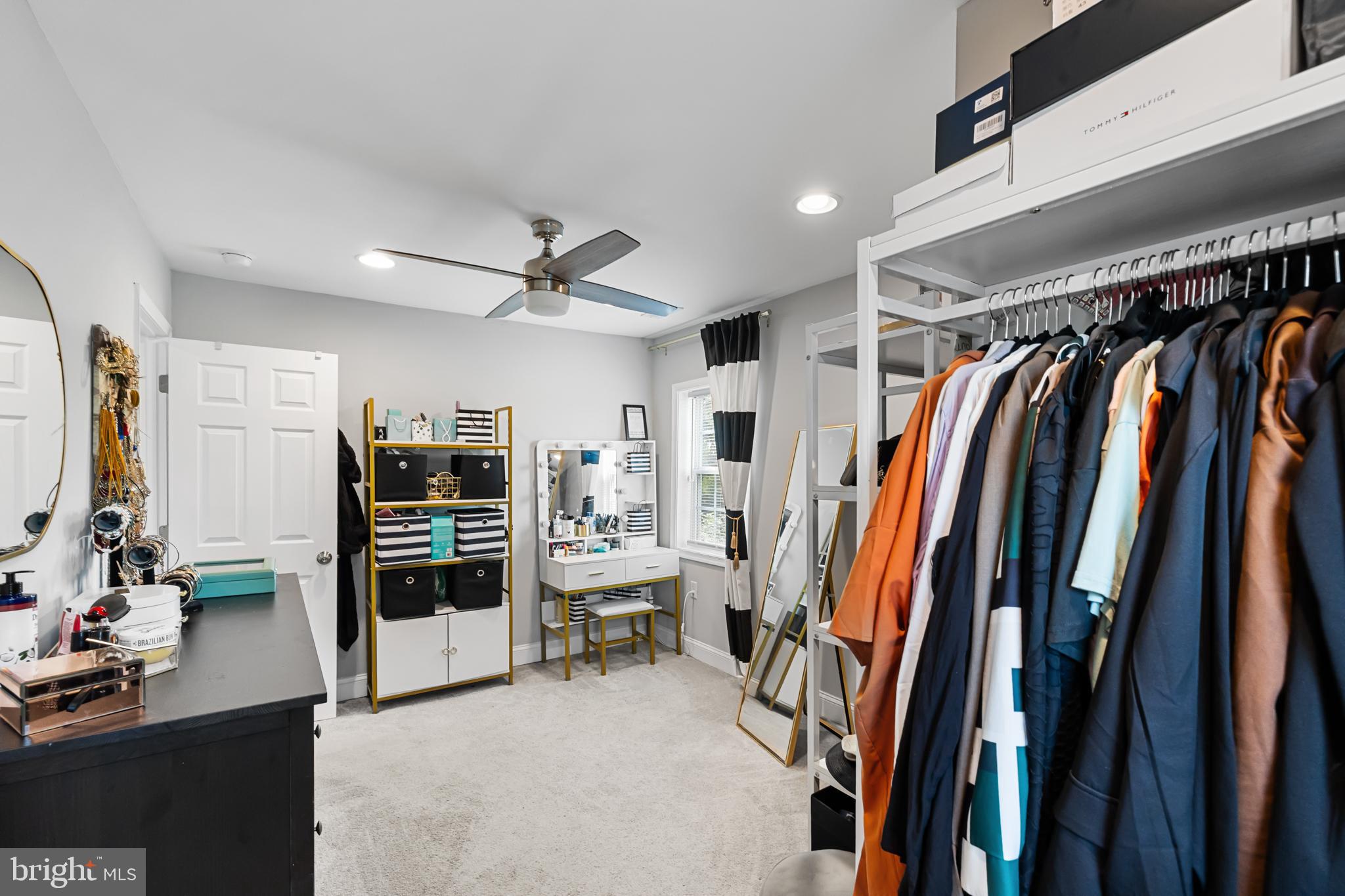 3327 5th Street Southeast Washington, DC 20032 - Photo 33 of 42 a view of walk in closet with clothes and shoes