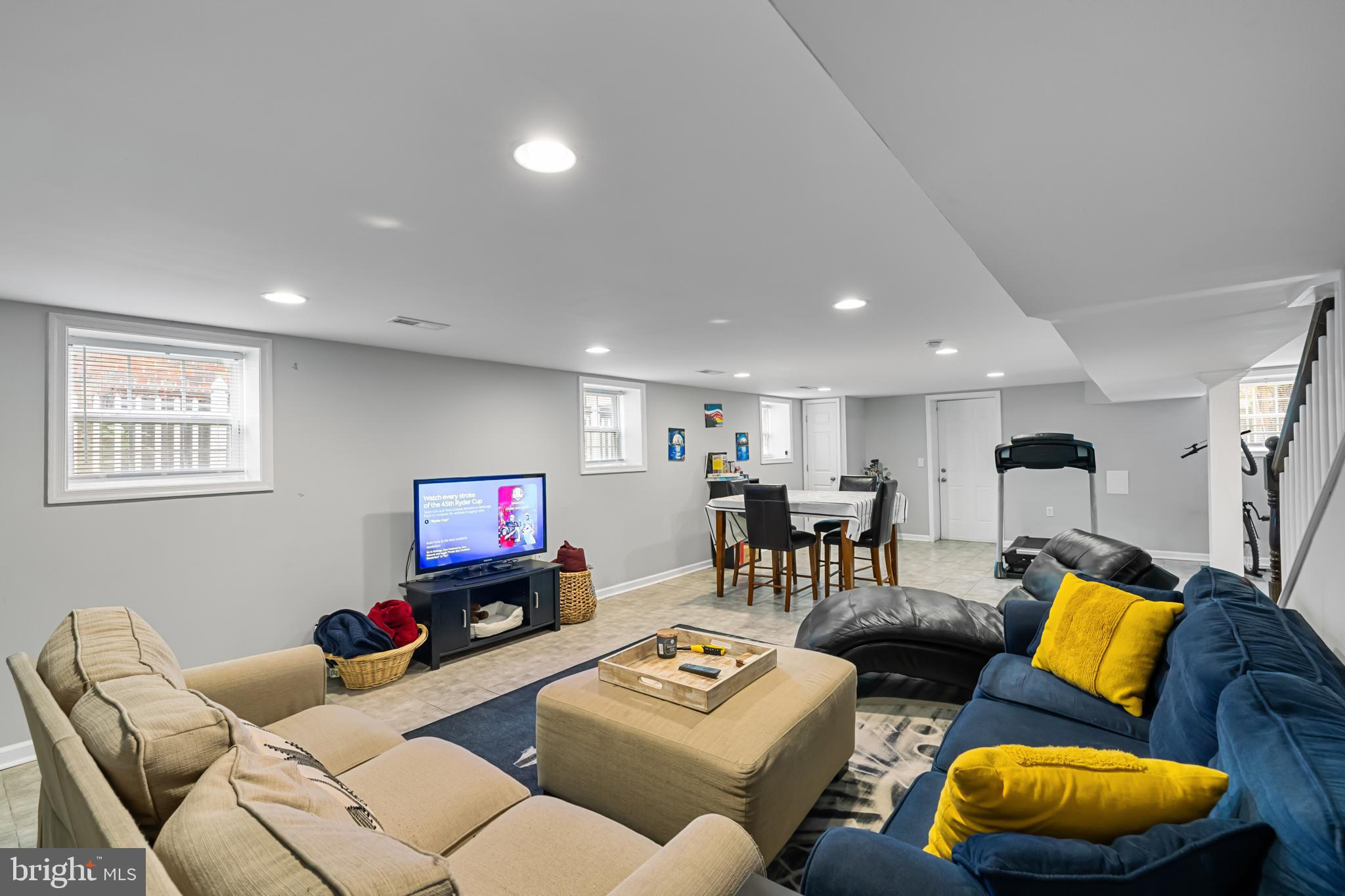 3327 5th Street Southeast Washington, DC 20032 - Photo 37 of 42 a living room with furniture and a flat screen tv