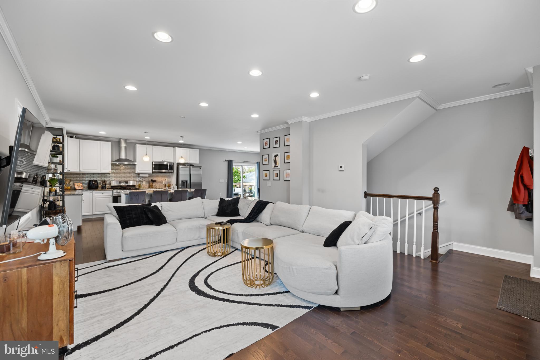 3327 5th Street Southeast Washington, DC 20032 - Photo 6 of 42 a living room with furniture and a wooden floor