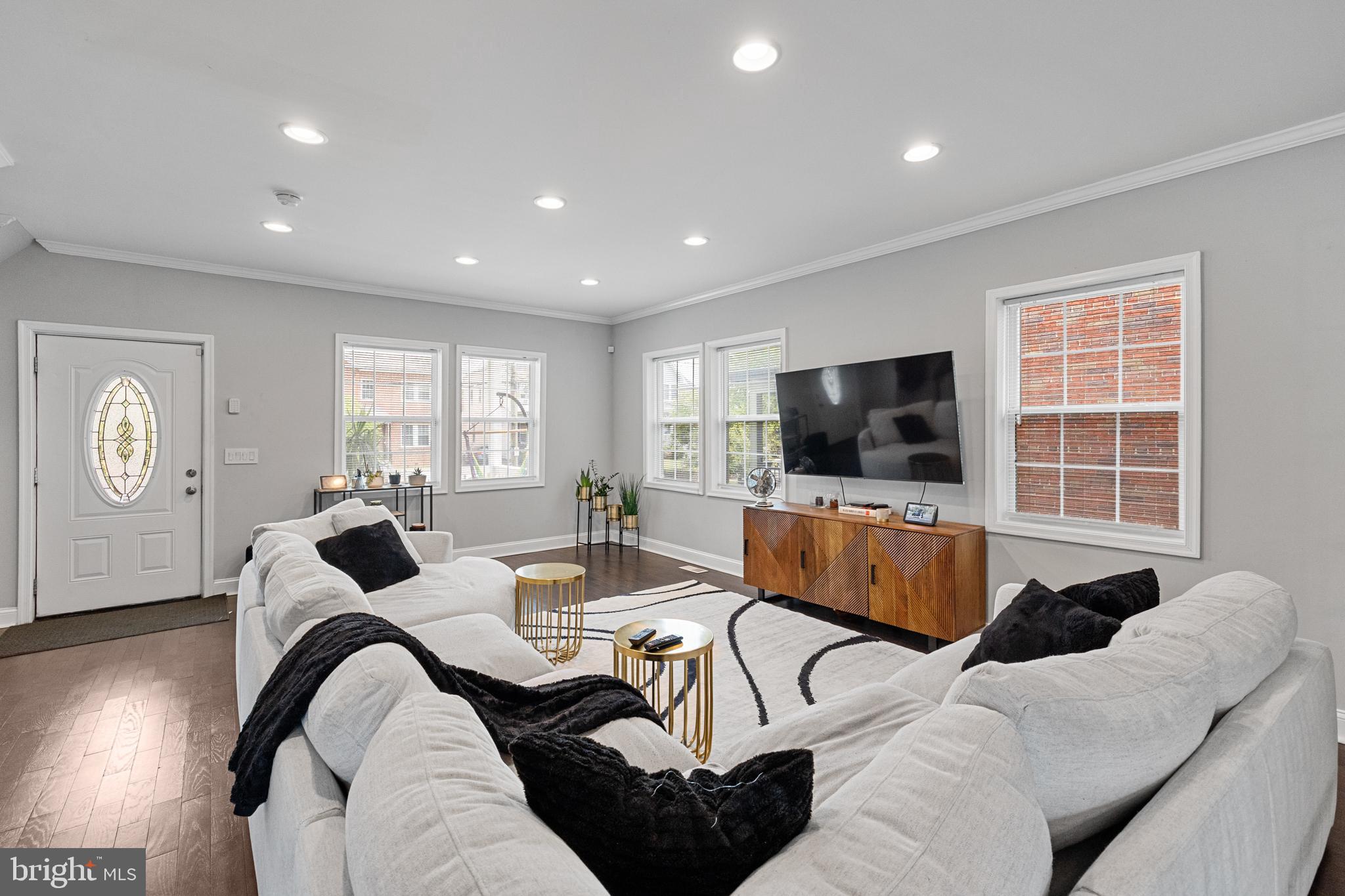 3327 5th Street Southeast Washington, DC 20032 - Photo 7 of 42 a living room with furniture window and a flat screen tv