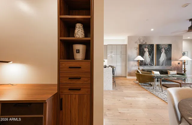 a kitchen with stainless steel appliances granite countertop a kitchen island a stove a sink a dining table and chairs