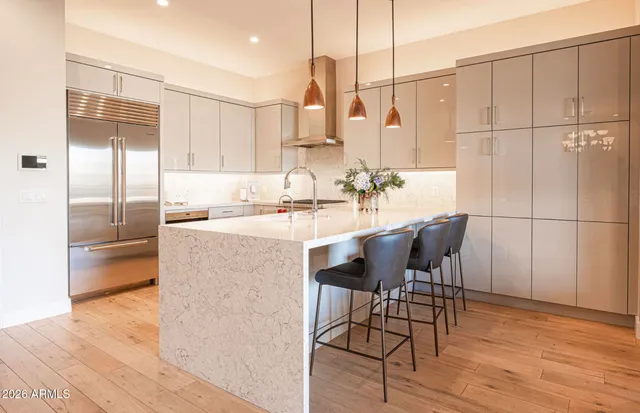 a kitchen with a table and chairs
