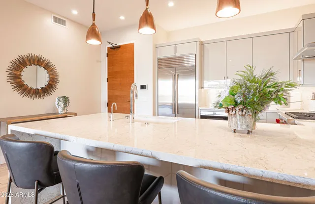 a bedroom with a bed and a television