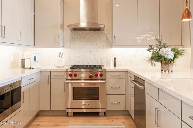 a bedroom with a bed and a dresser next to a window