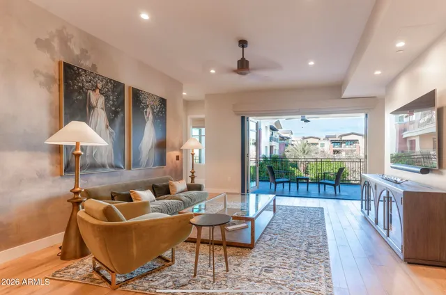 a living room with furniture and a rug