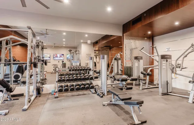 a view of a patio with couches table and chairs and potted plants