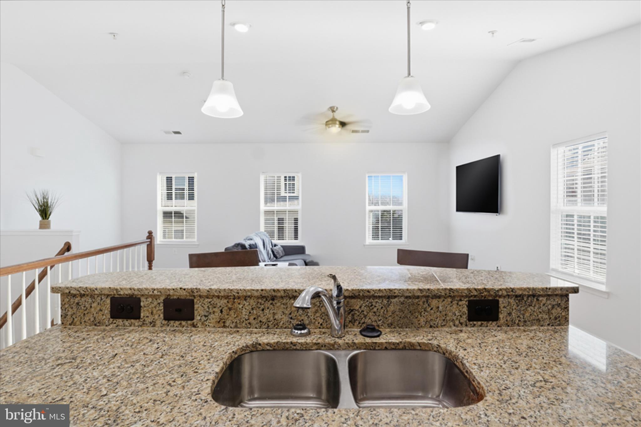 7455 Brunson Circle Gainesville, VA 20155 - Photo 17 of 41 a bathroom with a granite countertop sink a mirror and shower