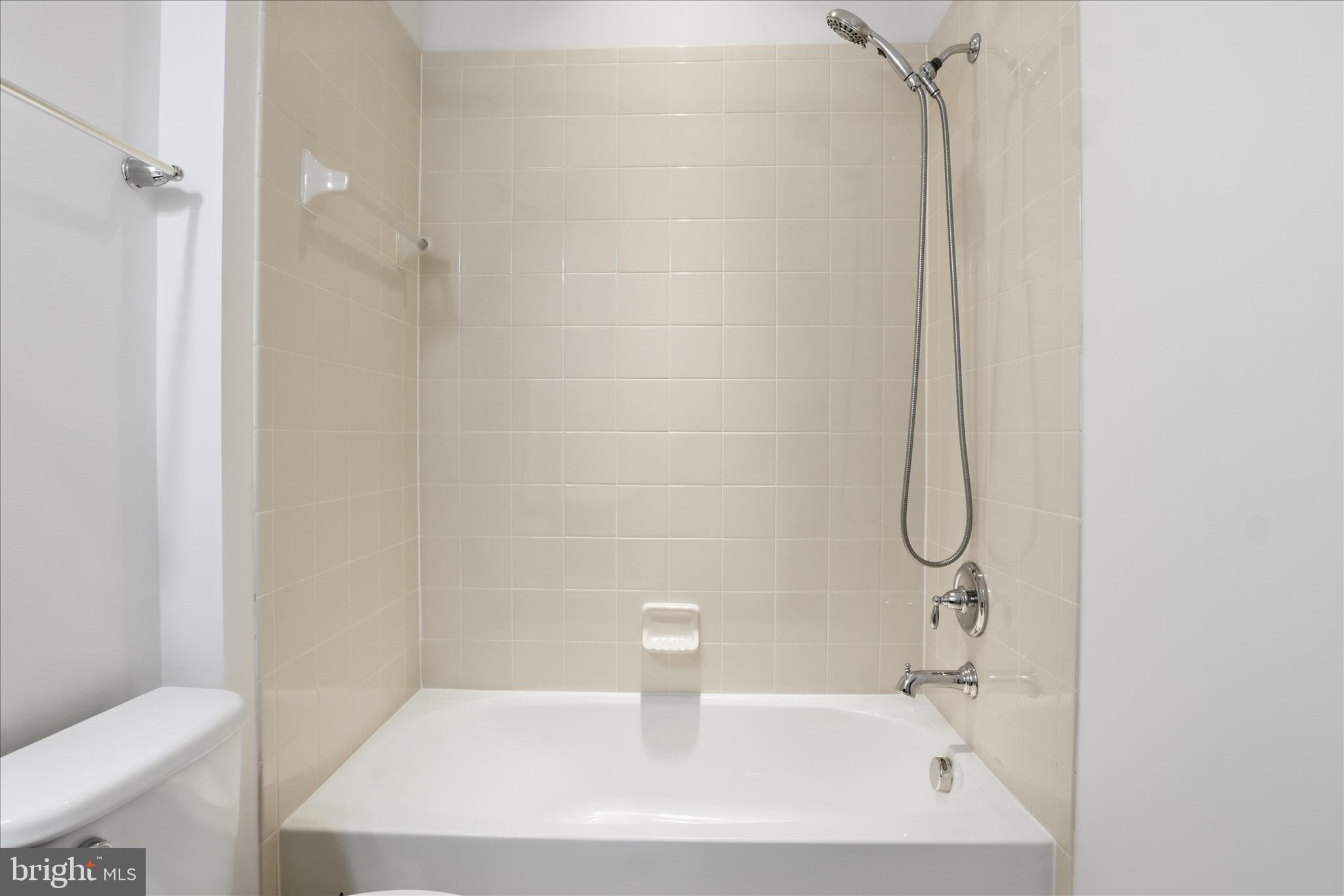 7455 Brunson Circle Gainesville, VA 20155 - Photo 22 of 41 a bathroom with a sink a toilet and shower