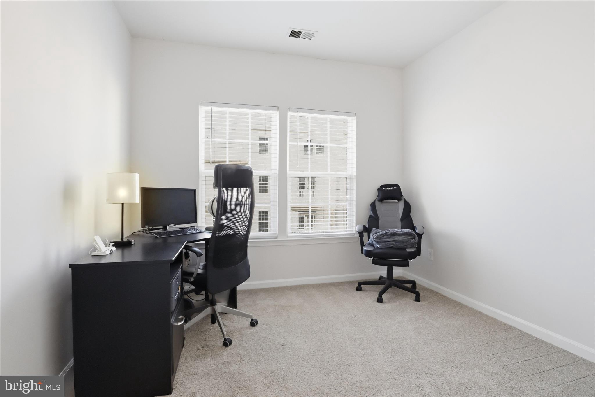 7455 Brunson Circle Gainesville, VA 20155 - Photo 25 of 41 a view of a workspace with furniture and a window