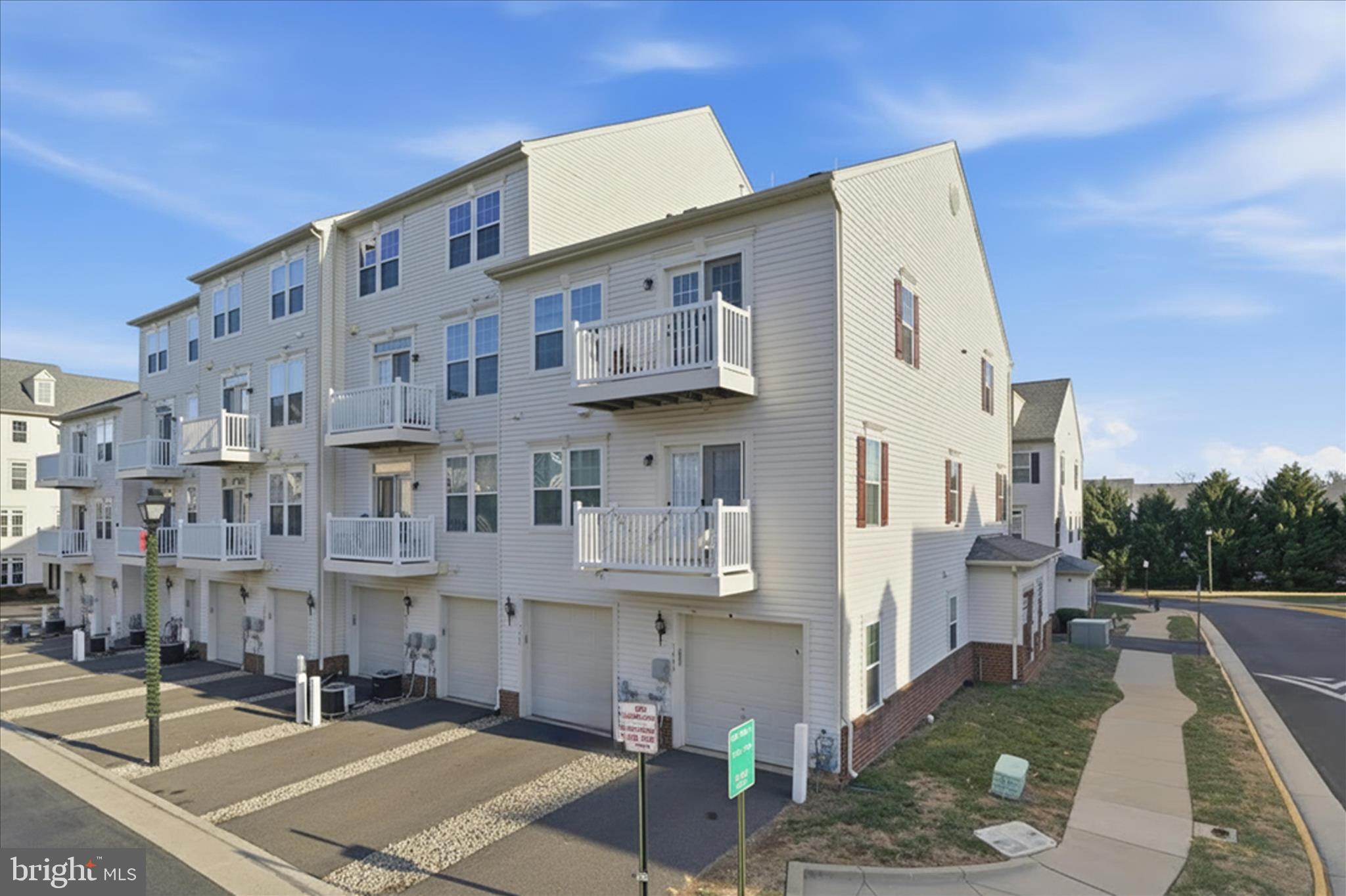 7455 Brunson Circle Gainesville, VA 20155 - Photo 3 of 41 a front view of a building with street view