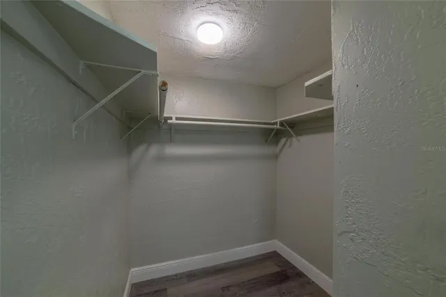 a view of an empty walk in closet