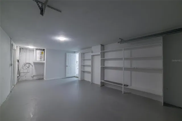 a view of an empty room and a window