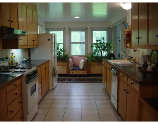 79 Bare Hill Road Bolton, MA 01740 - Photo 4 of 12 a kitchen with stainless steel appliances a sink stove and cabinets