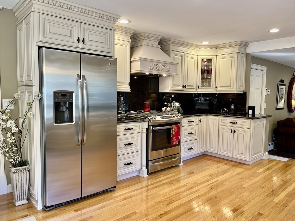 27 Mark Circle Holden, MA 01520 - Photo 11 of 39 a kitchen with stainless steel appliances a refrigerator sink and cabinets