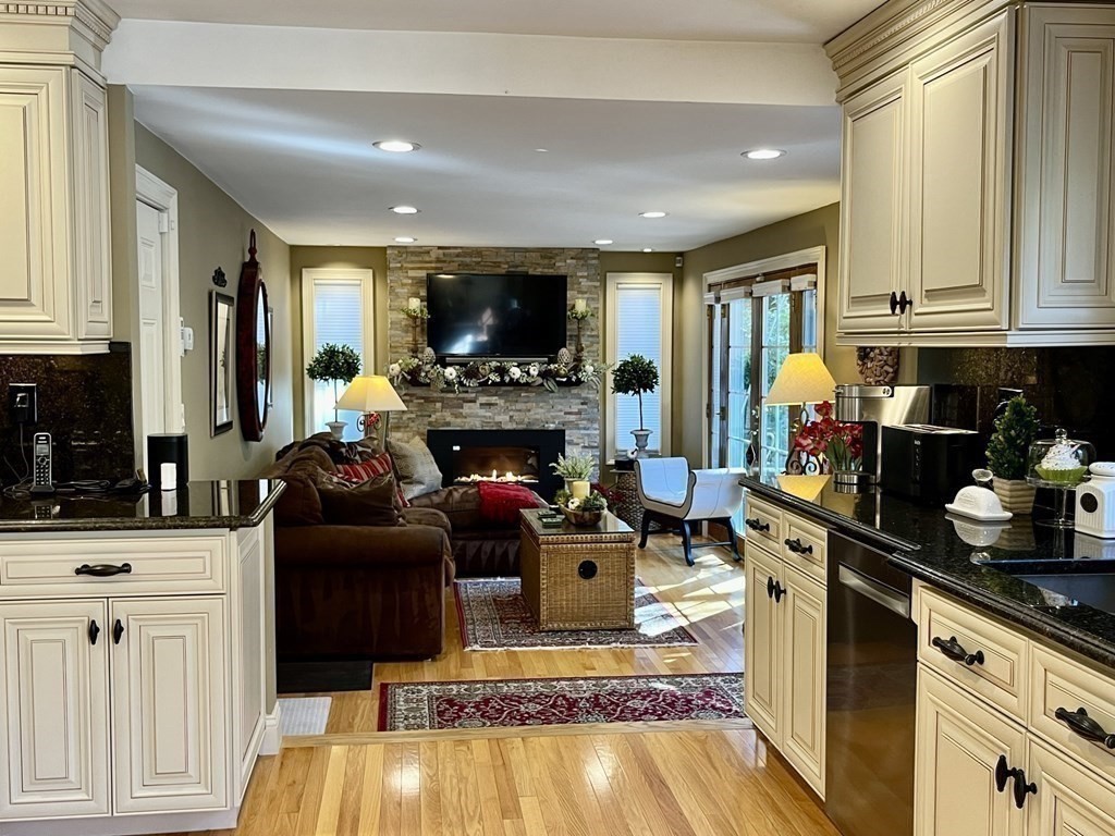 27 Mark Circle Holden, MA 01520 - Photo 12 of 39 a living room with furniture a flat screen tv and a fireplace