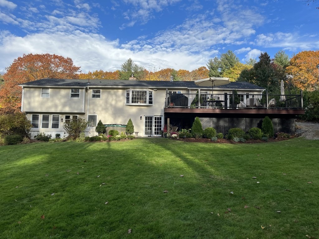 27 Mark Circle Holden, MA 01520 - Photo 2 of 39 a view of a house with a big yard and large trees
