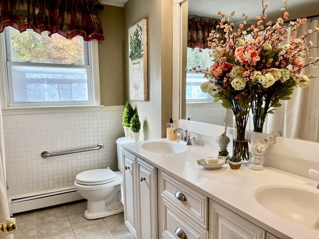 27 Mark Circle Holden, MA 01520 - Photo 22 of 39 a bathroom with a toilet sink and mirror