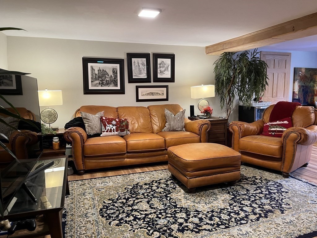 27 Mark Circle Holden, MA 01520 - Photo 23 of 39 a living room with furniture a couch and a lamp