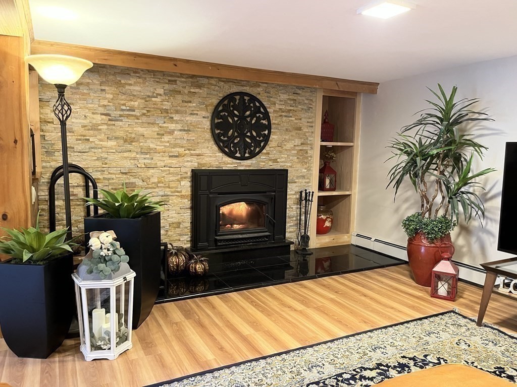 27 Mark Circle Holden, MA 01520 - Photo 25 of 39 a living room with furniture and a fireplace