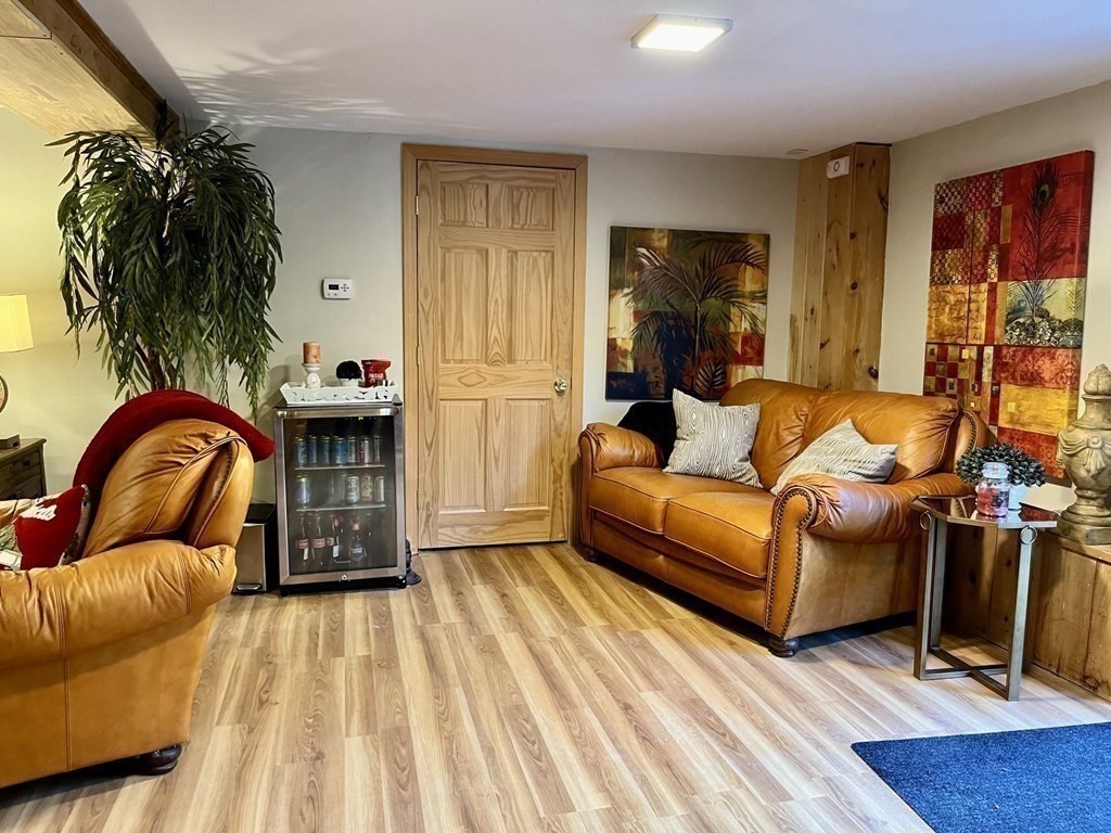 27 Mark Circle Holden, MA 01520 - Photo 26 of 39 a living room with furniture and wooden floor