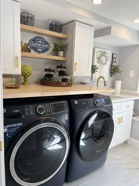 27 Mark Circle Holden, MA 01520 - Photo 30 of 39 a utility room with dryer and washer