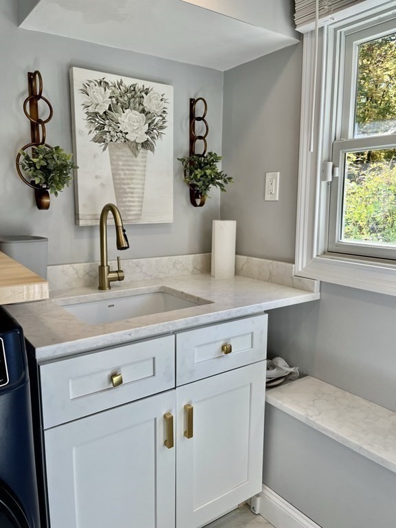 27 Mark Circle Holden, MA 01520 - Photo 31 of 39 a bathroom with a sink and a mirror