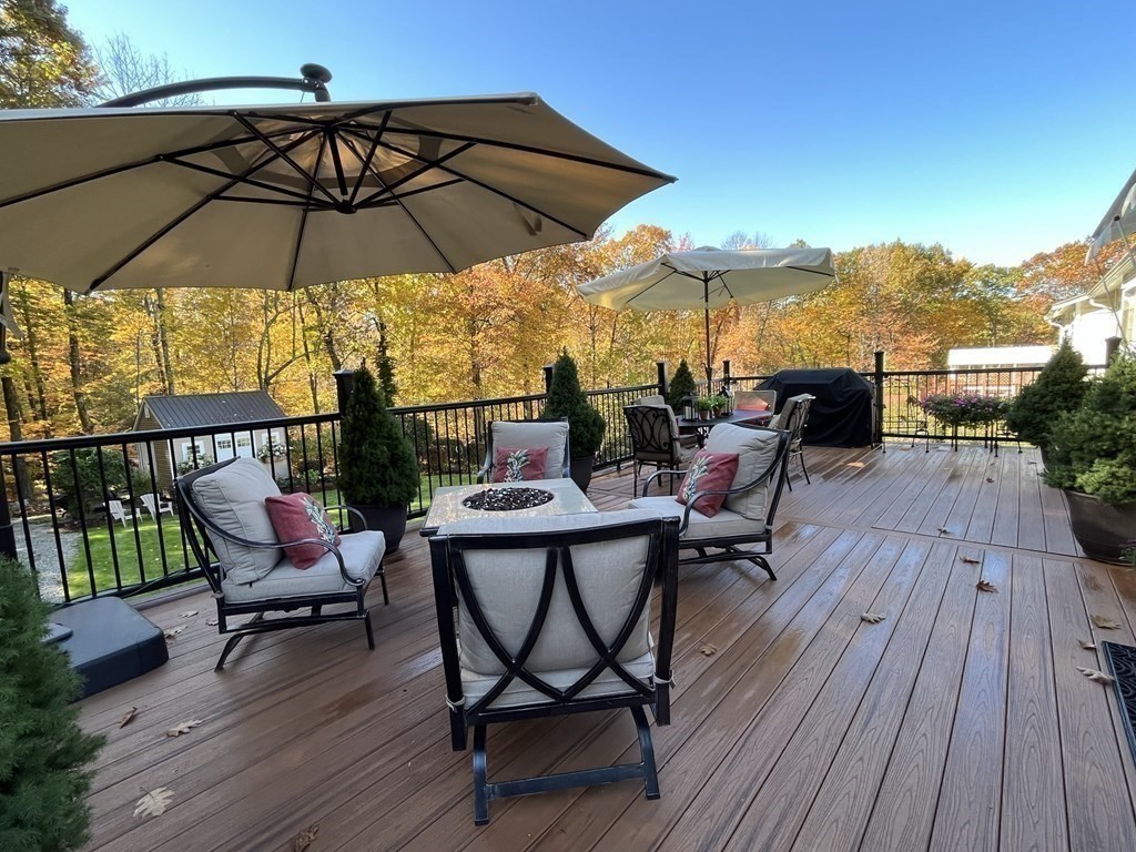 27 Mark Circle Holden, MA 01520 - Photo 32 of 39 a view of a chairs and table in the wooden deck