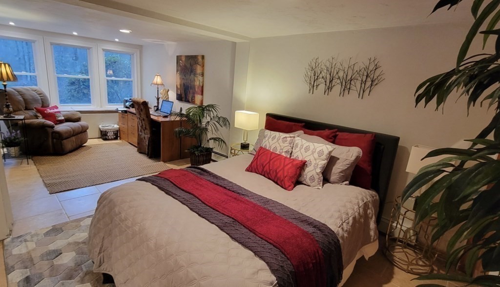 27 Mark Circle Holden, MA 01520 - Photo 34 of 39 a bed room with a bed and a couch