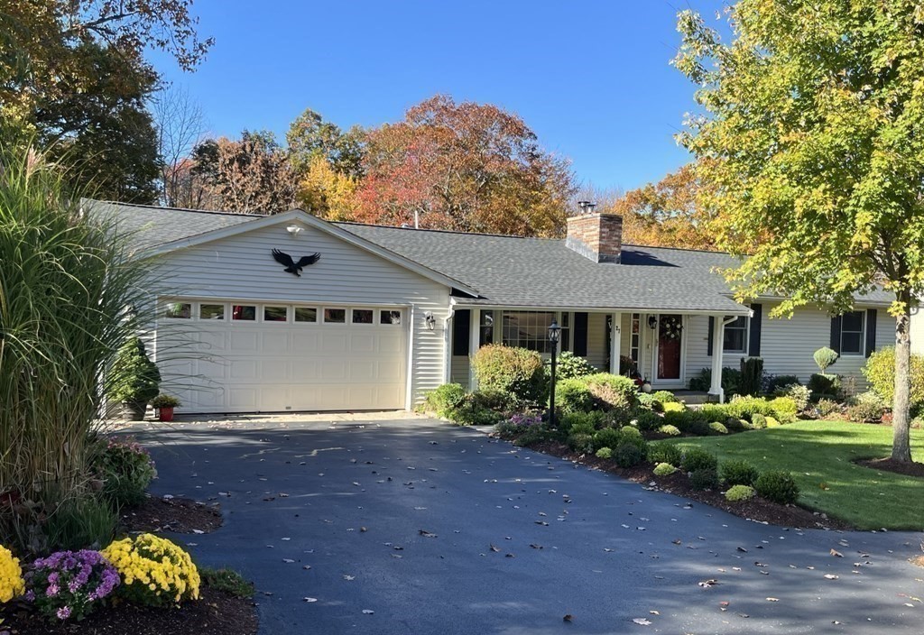 27 Mark Circle Holden, MA 01520 - Photo 39 of 39 a front view of a house with a yard and garage