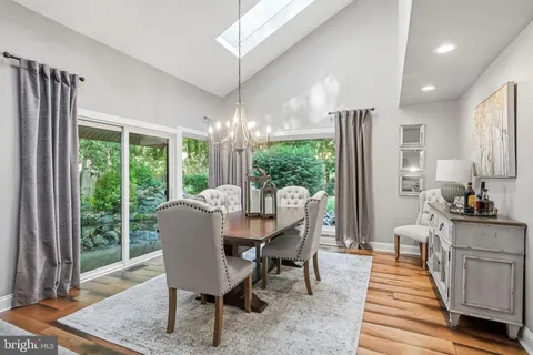 a kitchen with stainless steel appliances a refrigerator sink and microwave