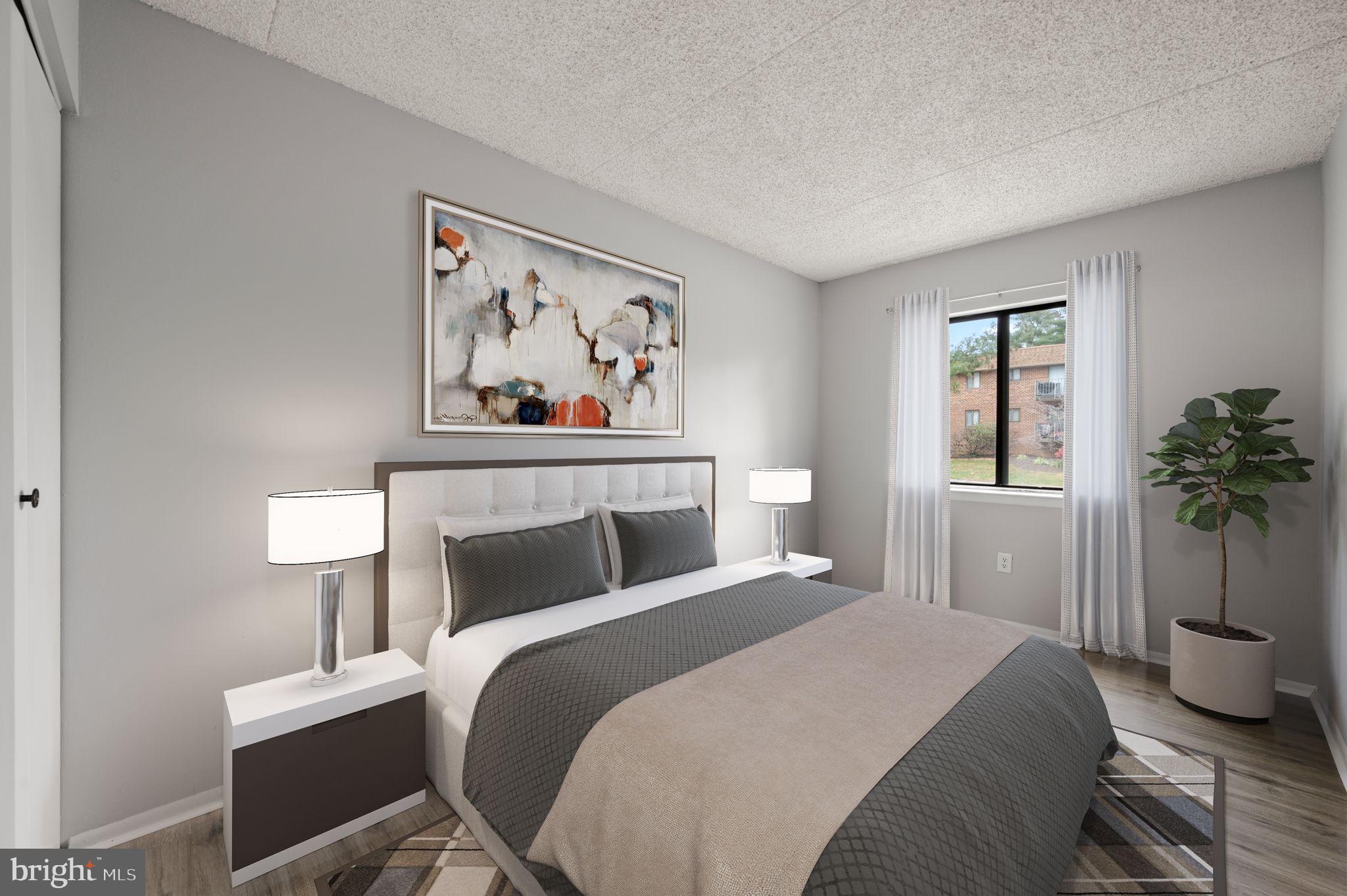 336 Saybrook Lane Wallingford, PA 19086 - Photo 14 of 22 a bedroom with a bed and a painting on the wall