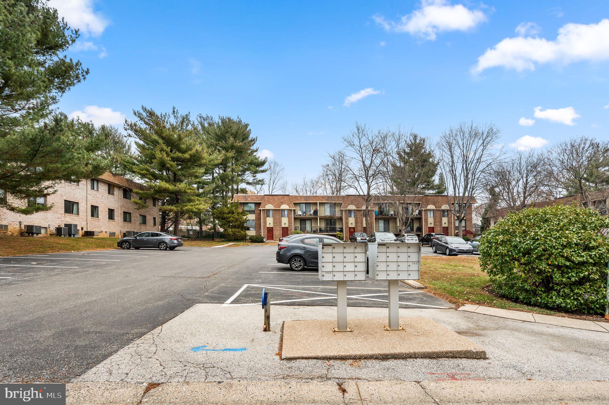 336 Saybrook Lane Wallingford, PA 19086 - Photo 22 of 22 a view of a patio with couches and table and chairs with wooden fence