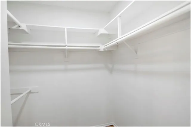 a view of room with window and ceiling fan