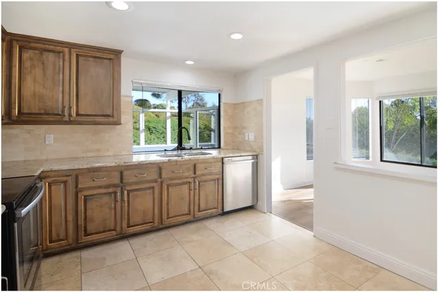 a kitchen with a refrigerator stove and microwave