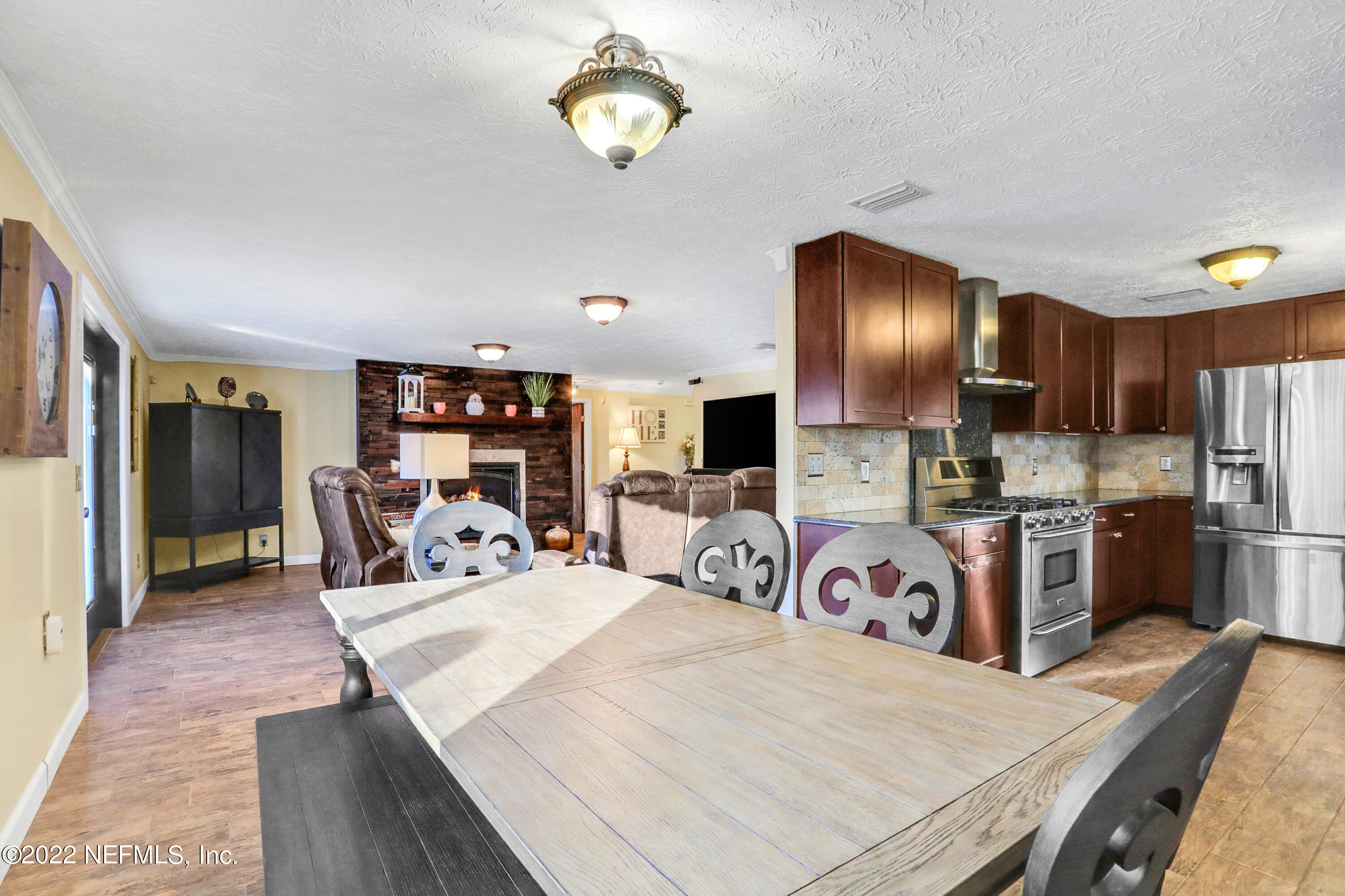 2198 Carter Braxton Road Orange Park, FL 32073 - Photo 20 of 33 a kitchen with stainless steel appliances granite countertop a sink dishwasher a refrigerator and a stove with wooden floor