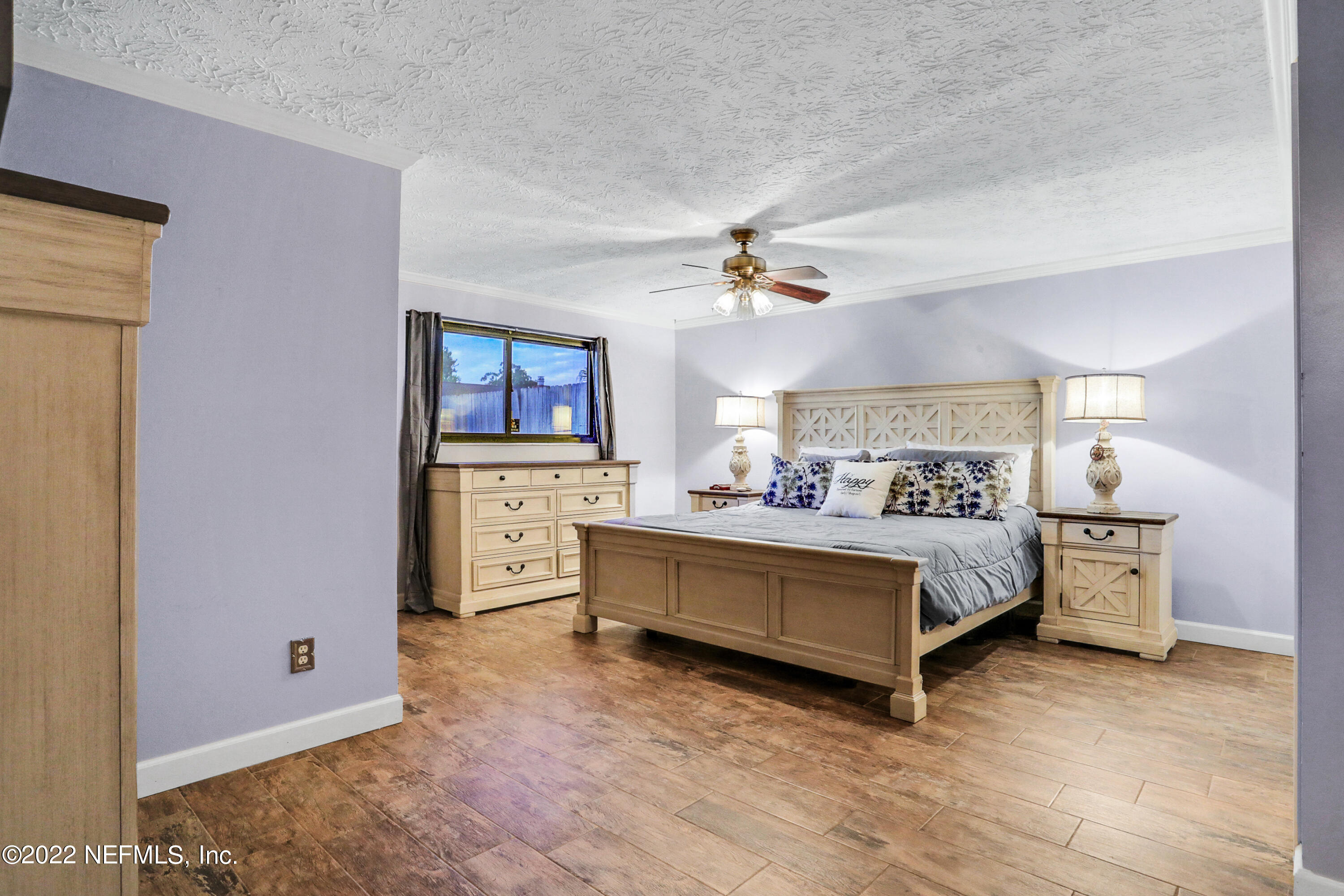 2198 Carter Braxton Road Orange Park, FL 32073 - Photo 24 of 33 a spacious bedroom with a bed and a table