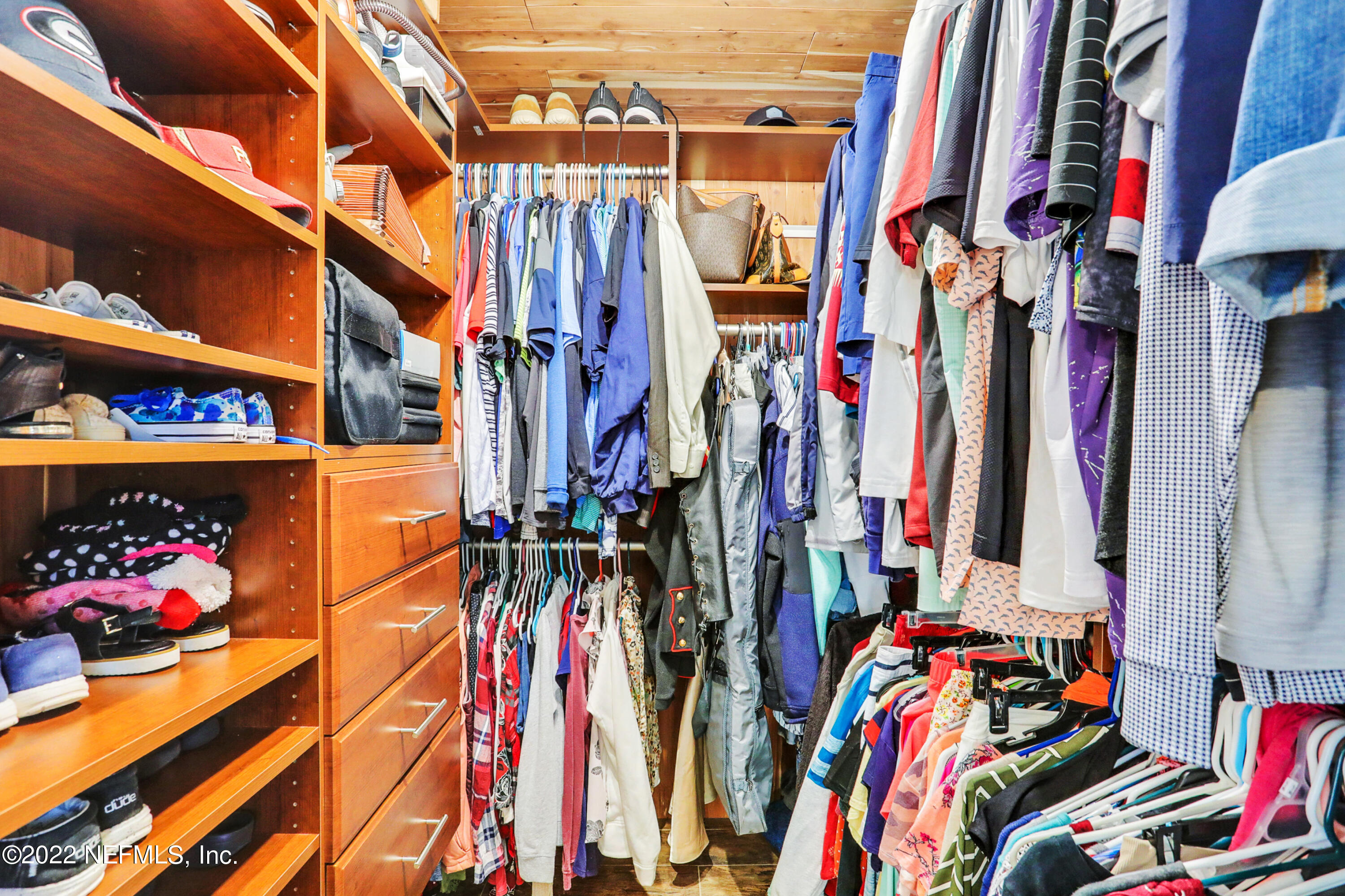 2198 Carter Braxton Road Orange Park, FL 32073 - Photo 26 of 33 a view of walk in closet with clothes and shoes