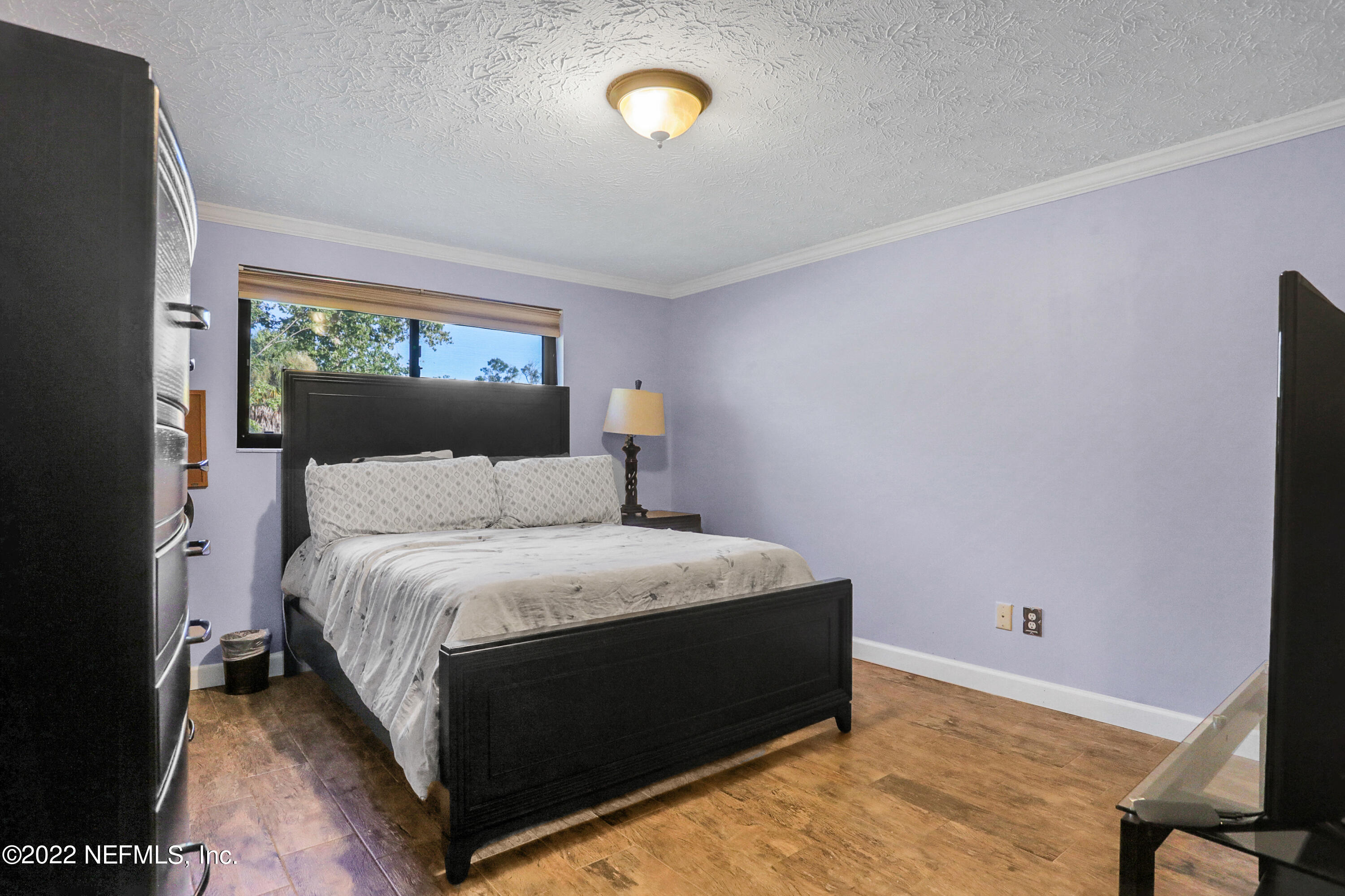 2198 Carter Braxton Road Orange Park, FL 32073 - Photo 29 of 33 a bedroom with a bed and a window
