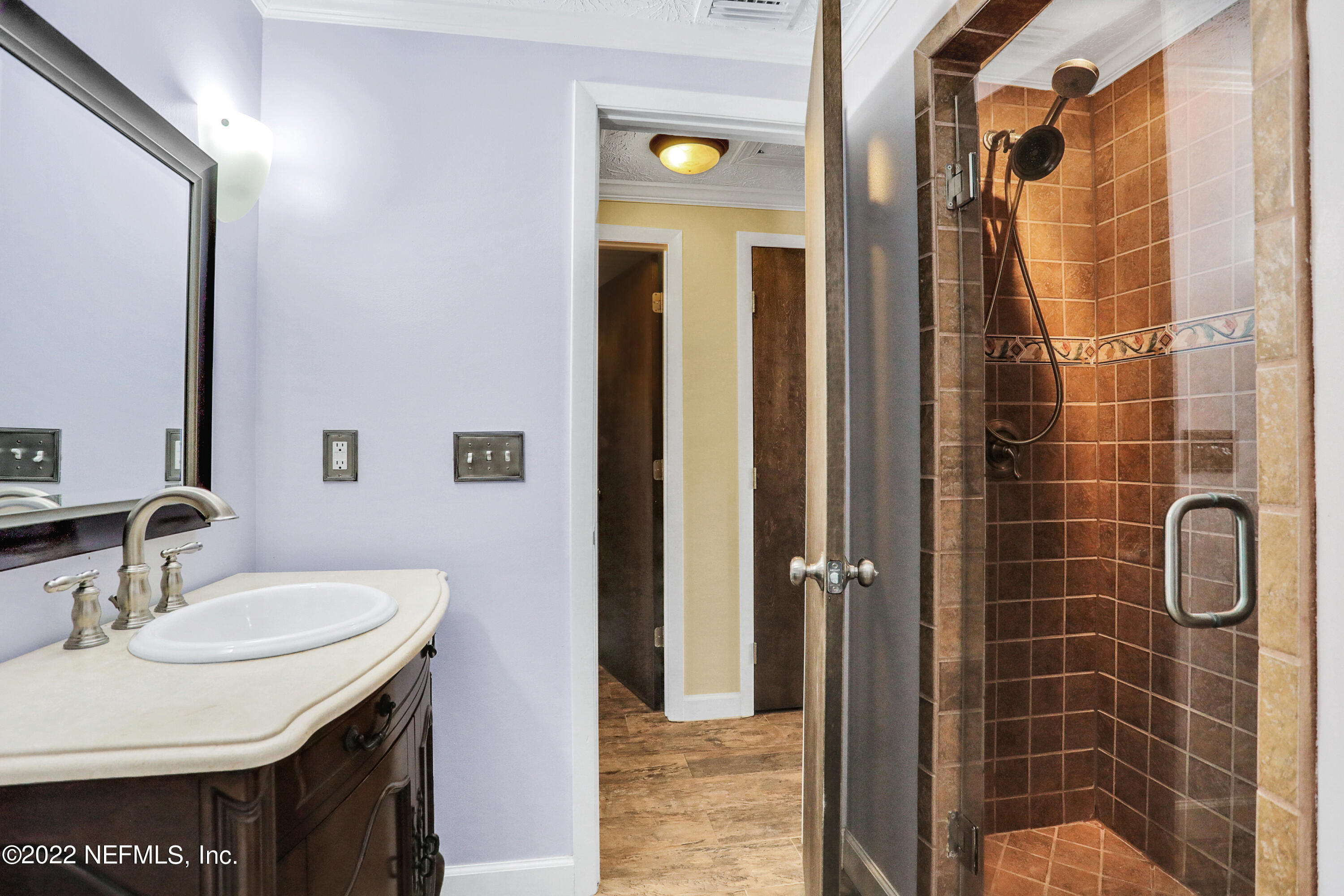 2198 Carter Braxton Road Orange Park, FL 32073 - Photo 32 of 33 a bathroom with a sink and a mirror