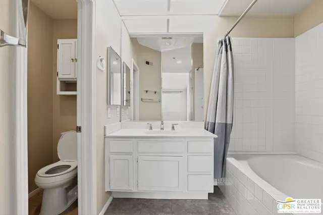 a view of a hallway with kitchen and entryway