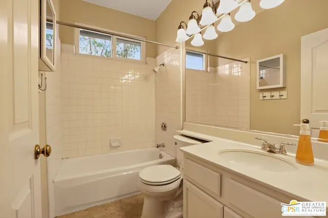 a view of a livingroom with hardwood floor and a ceiling fan