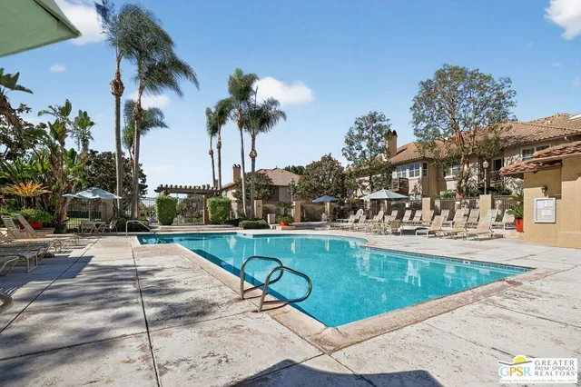a view of a patio with a table and chairs