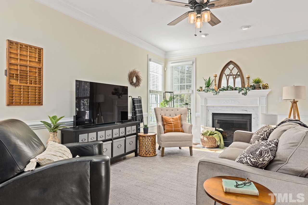 1616 Kendall Hill Road Willow Spring, NC 27592 - Photo 3 of 30 Sunny, open great room with gas logs fireplace and recessed lighting.